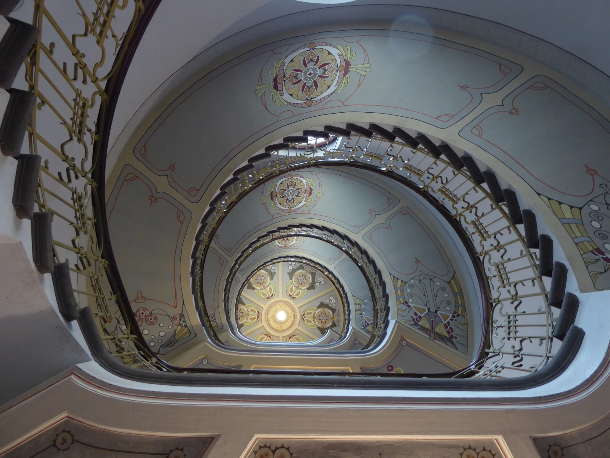 The painted spiral staircase inside the Riga Art Nouveau Museum on Alberta iela