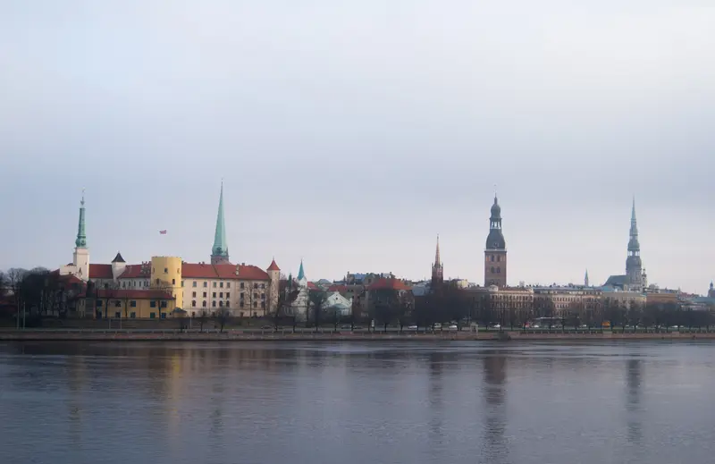 The Riga Old Town skyline across the Daugava: Riga Castle, the Cathedral tower and St. Peter's spire