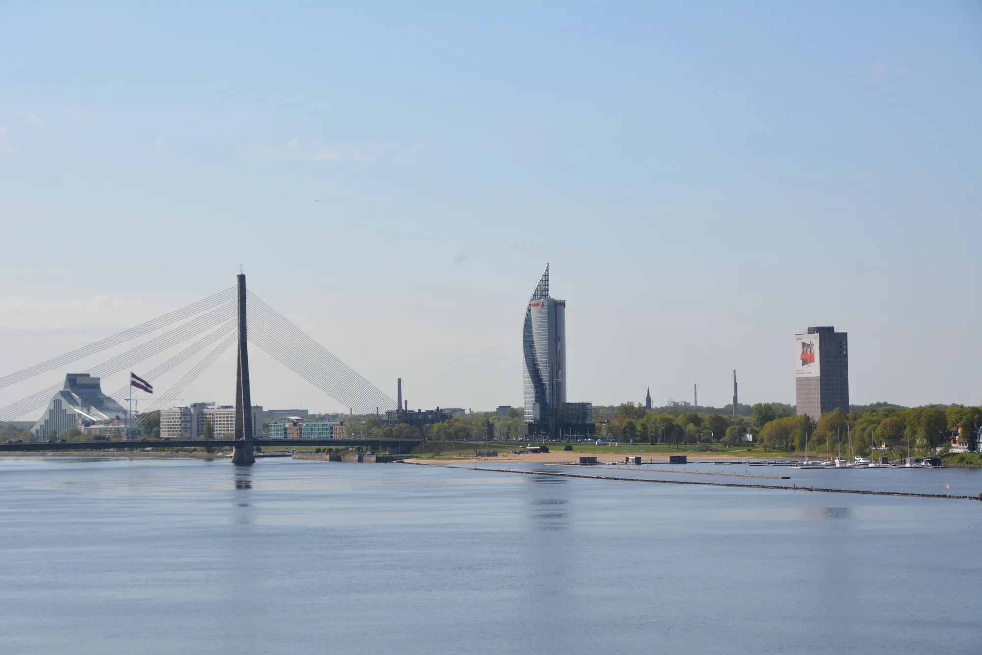 Kipsala island in Riga with the Vansu cable-stayed bridge and the Saules Akmens tower across the Daugava