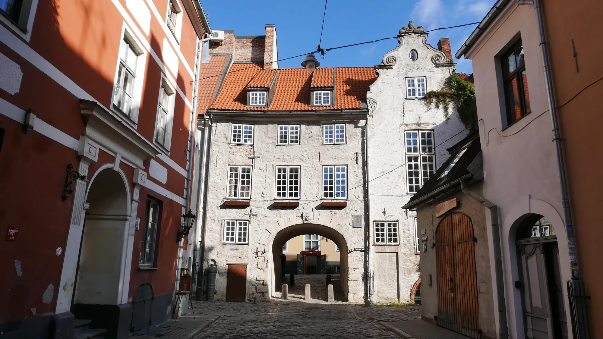 The Swedish Gate, a narrow archway tunnelling through a building, the only surviving city gate in Riga's Old Town