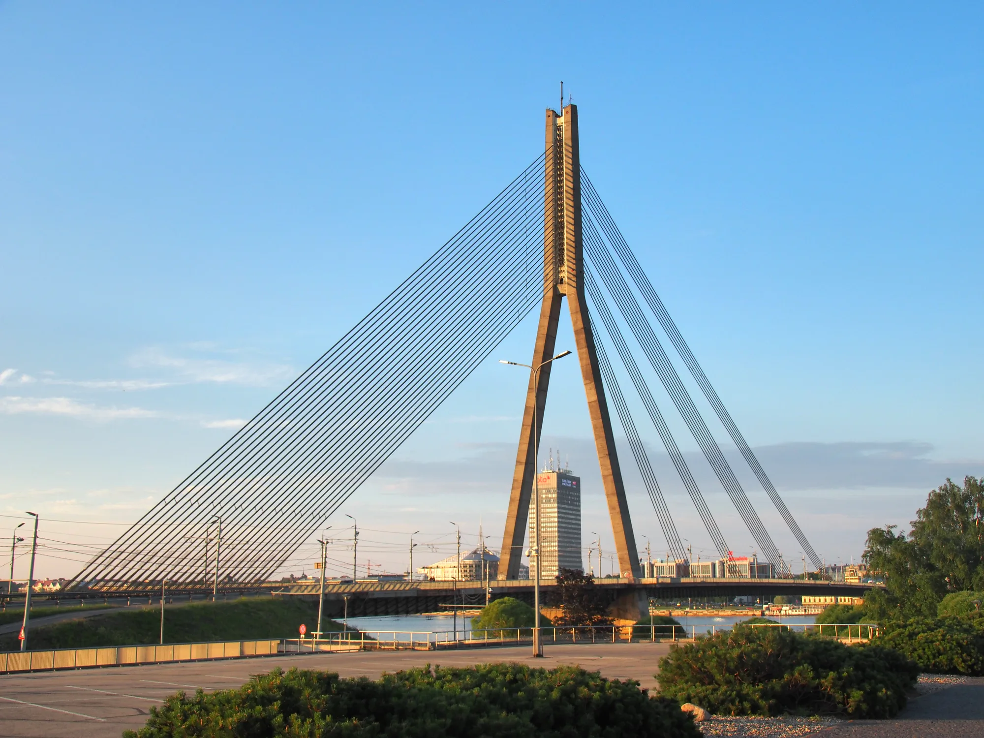 The white single-pylon Vansu cable-stayed bridge spanning the Daugava river in Riga